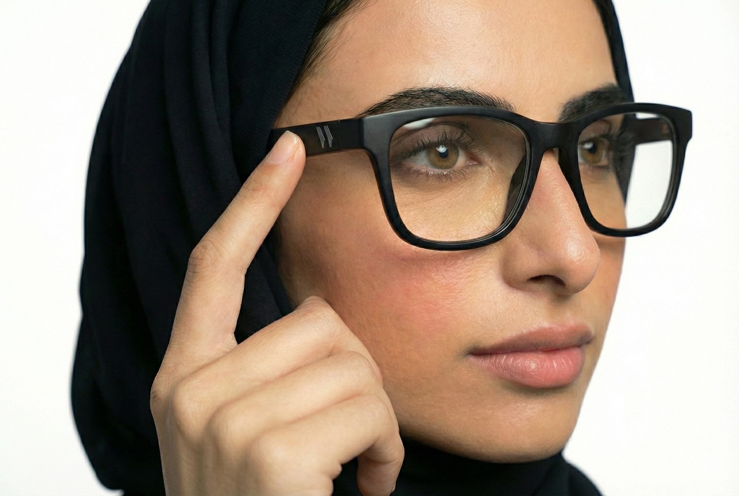 Model wearing WaSun glasses with clear lenses indoors